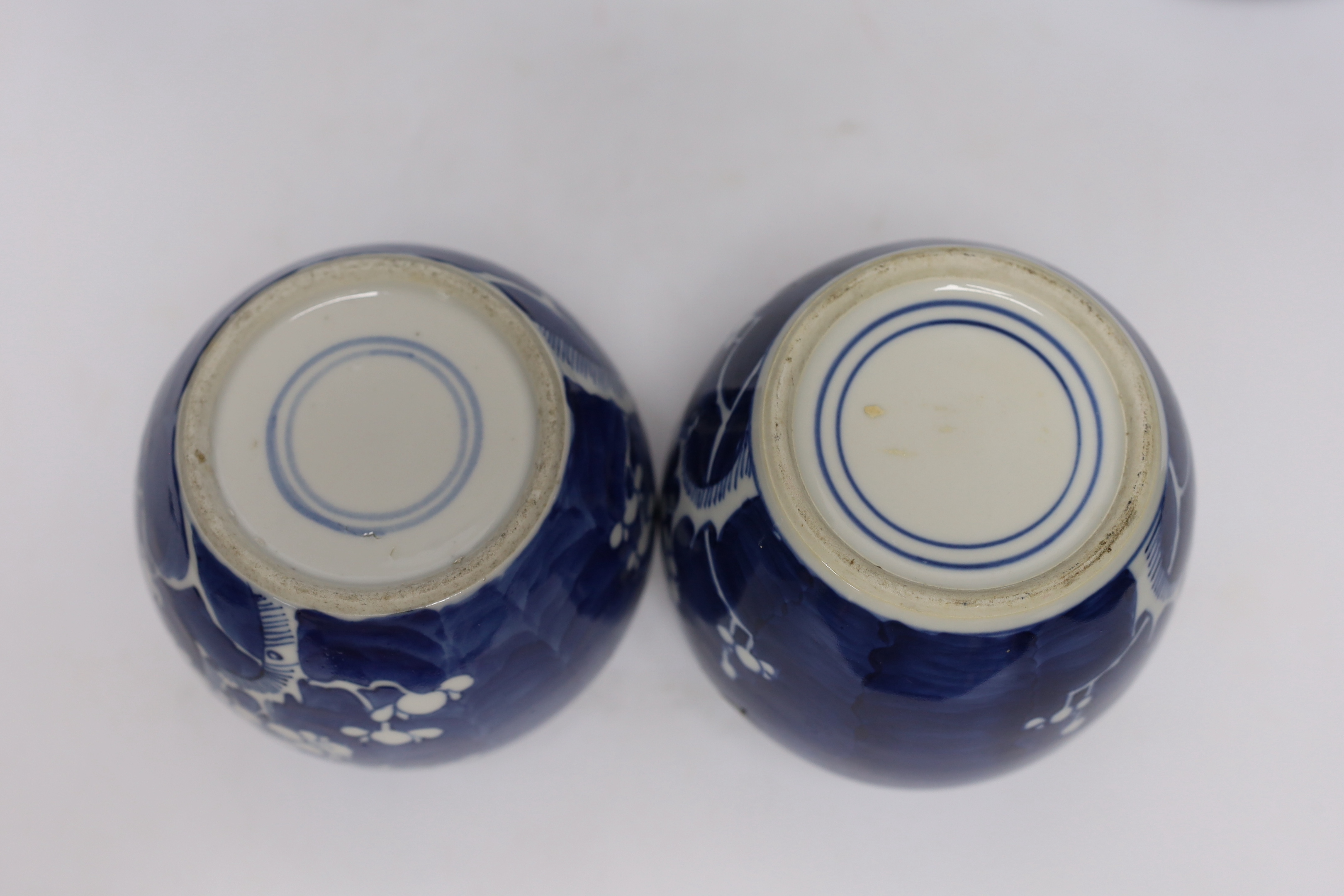 A collection of Chinese blue and white ginger jars including seven prunus flower examples, largest 18cm high